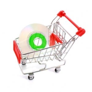 Mini CD in shopping cart isolated on white