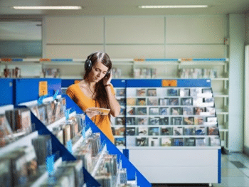 Female listening to music in a music shop