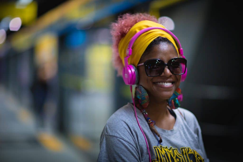 Headphones allow music to be more easily perceived, as they cancel out background noise.
